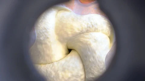 The process of kneading cake cream in a mixer top view Stock Footage 119664307