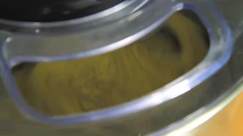 Process of kneading dough in food processor. Preparation of dough for baking in Stock Footage 220726055