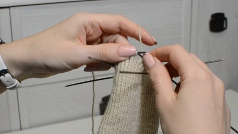 Process of knitting gloves with knitting needles Stock Footage 89728211