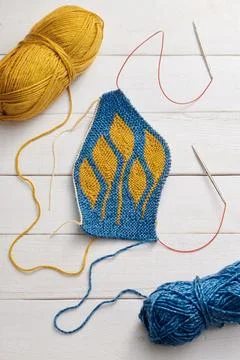 The process of knitting a hat with circular knitting needles using the shor.. Stock Photos