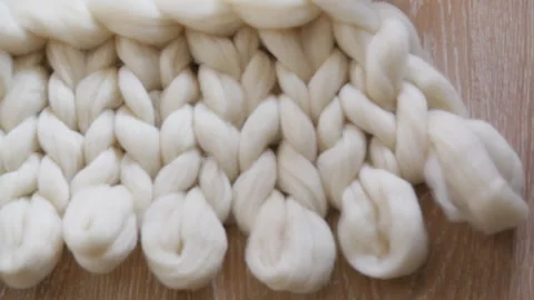 Process of knitting a plaid of large knitting from merino wool. Stock Footage 206386318