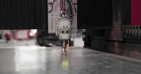 Process Of Laser Cutter Cutting Flat Metal Sheet In A Factory. - close up Stock Footage 142726658