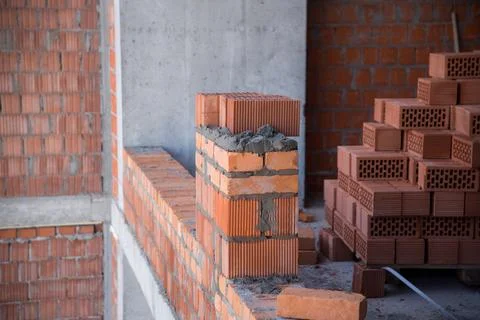 The process of laying bricks on construction site Stock Photos