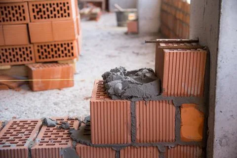 The process of laying bricks on construction site Stock Photos