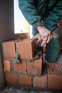 The process of laying bricks on construction site Stock Photos