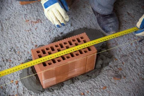 The process of laying bricks on construction site Foto stock