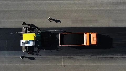 The process of laying new asphalt, drone view of road works Stockbeeldmateriaal 196218038