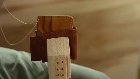 Process leather sewing bag details, hands with needle, workshop on saddler Stock Footage 139972136