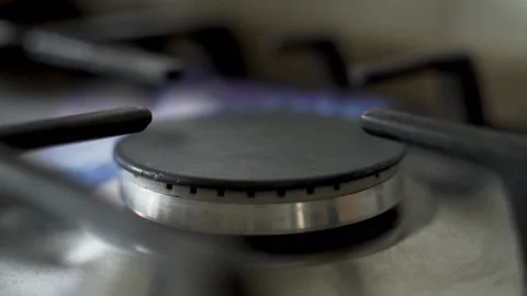 The Process of Lighting a Gas Stove in the Kitchen, Close-up. A Burning Flame fr Stock Footage 137153101