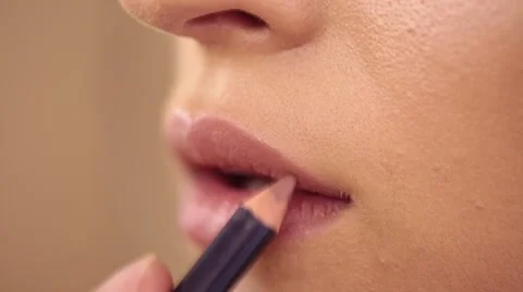 Process of lips make up with a paintbrush Stock Footage