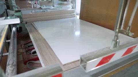 The process of loading the chipboard by means of a hydraulic hoist to a format Video stock 82696925