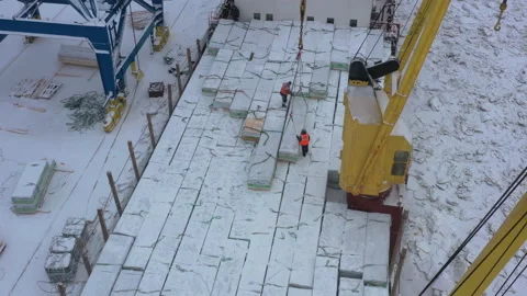 The process of loading a ship in the port in winter. Stock Footage 155558883