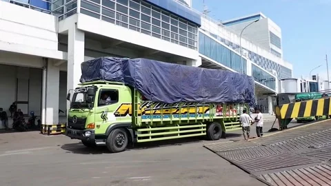 The process of loading a truck full of goods onto a ship Stock Footage 221892674