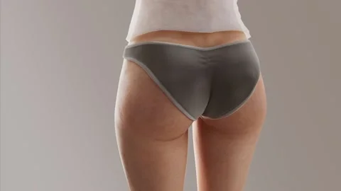 The process of losing weight.Close-up of the female buttocks and thighs Video stock 229708141