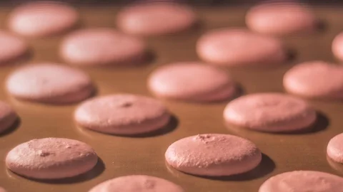 Process of macarons baking in oven with camera zoom effect Stock Footage 97665765