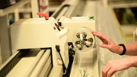 The process of machine operation at a factory manufacturing electrical wiri.. 動画素材 338347571