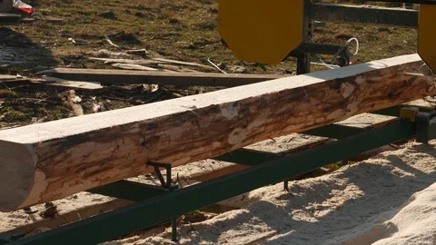 Process of machining logs in equipment sawmill machine Stock Footage 120055236
