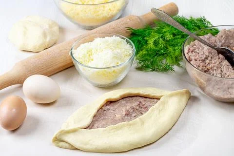 The process of making Adjarian khachapuri with raw ingredients Stock Photos