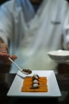 The process of making and decorating salmon sashimi. Stock Photos