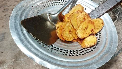 The process of making banana chips Stock Photos