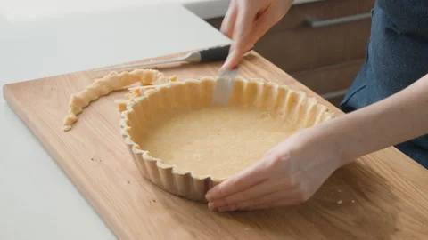 Process of making a base for lemon tart from shortbread dough Stock-Footage 200713642