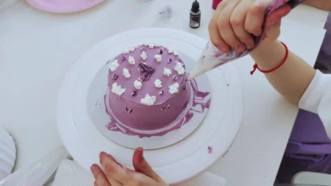 The process of making bento cake children hand. Decorating cake with cream. Stock Footage 273488283