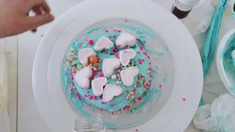The process of making bento cake children hand. Decorating cake with sprinkles. Stock Footage 273506968