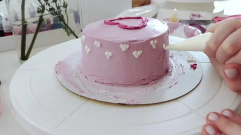 The process of making bento cake children hand. Decorating cake with white cream Stock Footage 273510873