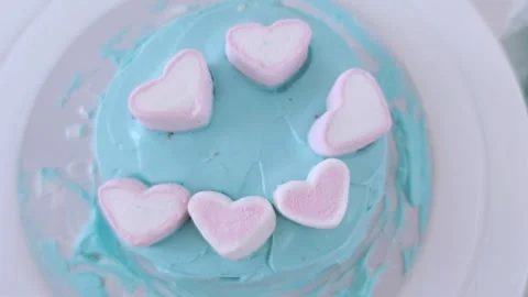 The process of making bento cake children hand. Decorating cake marshmallows. Video stock 273813433