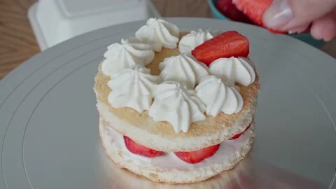 The process of making a bento cake female caucasian hand puts chopped Stock Footage 195238522