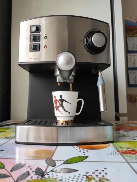 The process of making black coffee in a carob coffee machine Stock Footage 128823962