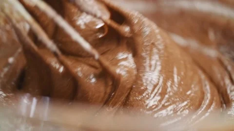 Process of making brownie. Stirring ingredients in a glass bowl. Stock Footage 165614660