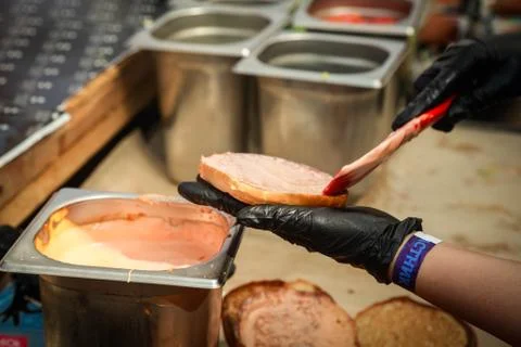 Process of making burger. chef hands in gloves cooking hamburgers and cheeseb Stock Photos