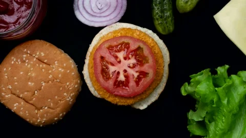 The process of making a burger from different ingredients. Stop motion animation Video stock 141049093