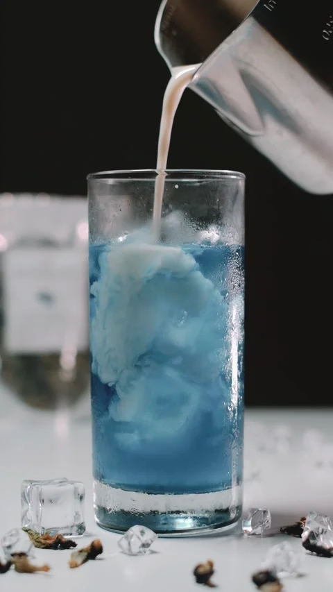 The Process of Making a Butterfly Pea Milk Tea Stock Footage 277648621