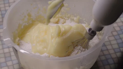 The process of making cake cream, laying ingredients for mixing with a mixer Stock Footage 304744560