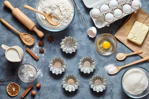 The process of making cake dough. Baking ingredients for homemade pastry on dark Stock Photos