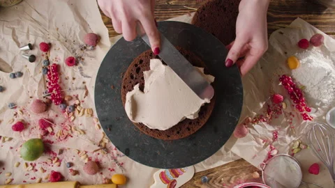 The process of making a cake. The pastry chef decorates the cake Stock Footage 168808741