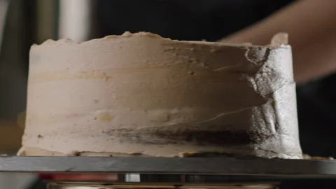 The process of making a cake. The pastry chef decorates the cake Stock Footage 168811405