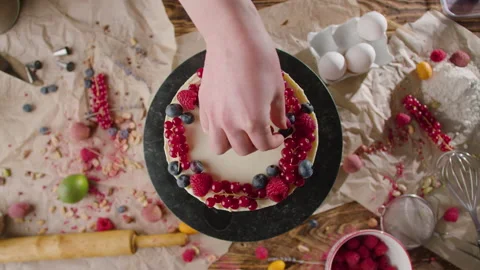 The process of making a cake. The pastry chef decorates the cake Stock Footage 168811507
