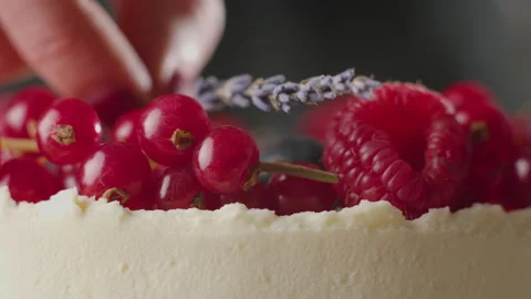 The process of making a cake. The pastry chef decorates the cake Stock Footage 168811960