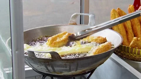 The process of making cakwe or youtiao traditional food Stock Footage 223465930