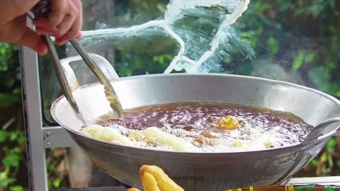 The process of making cakwe or youtiao traditional food Stock Footage 223465999