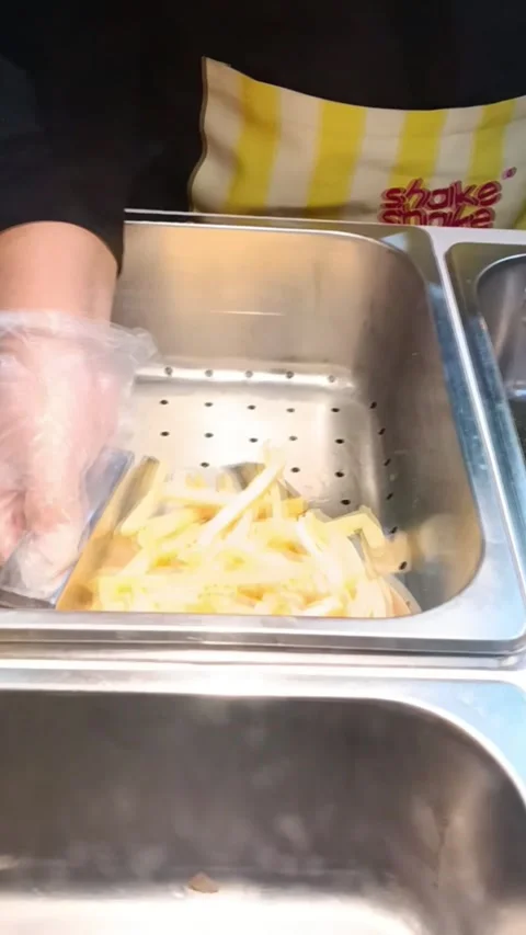 The process of making a cheap snack called French Fries Stock Footage 289163312