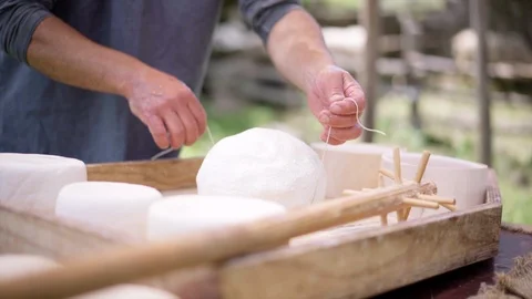 The process of making cheese. The homemade cheese producer in the Alps Mountains Stock-Footage 91522262