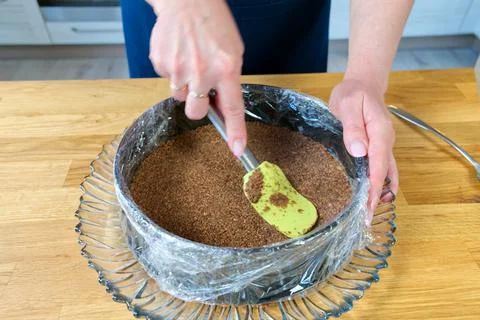 Process of making cheesecake with chocolate and strawberries. Sweet and tasty. Stock Photos