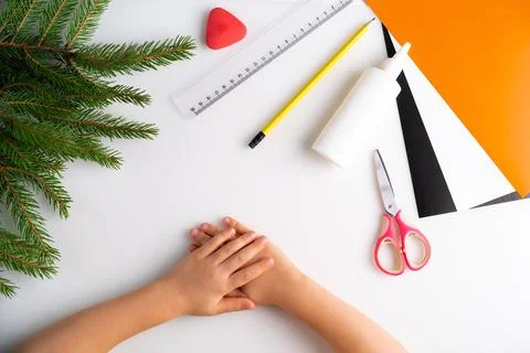 The process of making a children's New Year tiger mask with a child made of Stock Photos