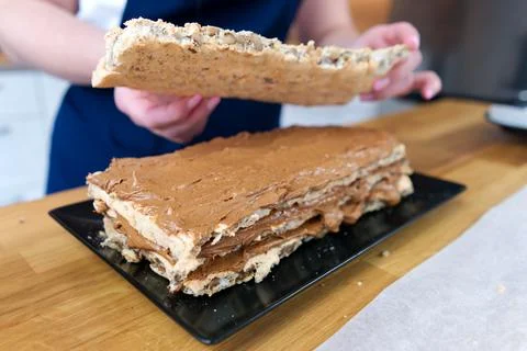 The process of making a chocolate cake with nuts and cream. Stock-Fotos