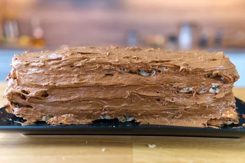 The process of making a chocolate cake with nuts and cream. Stock Photos