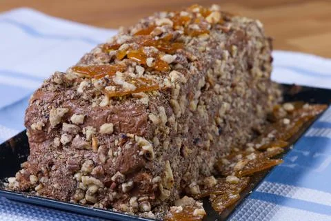 The process of making a chocolate cake with nuts and cream. Stock Photos